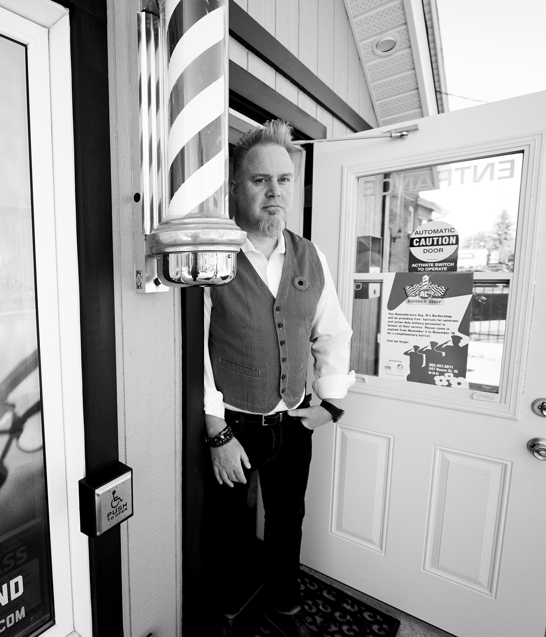 Rob Rutledge keeping the door to Al's Barbershop open.